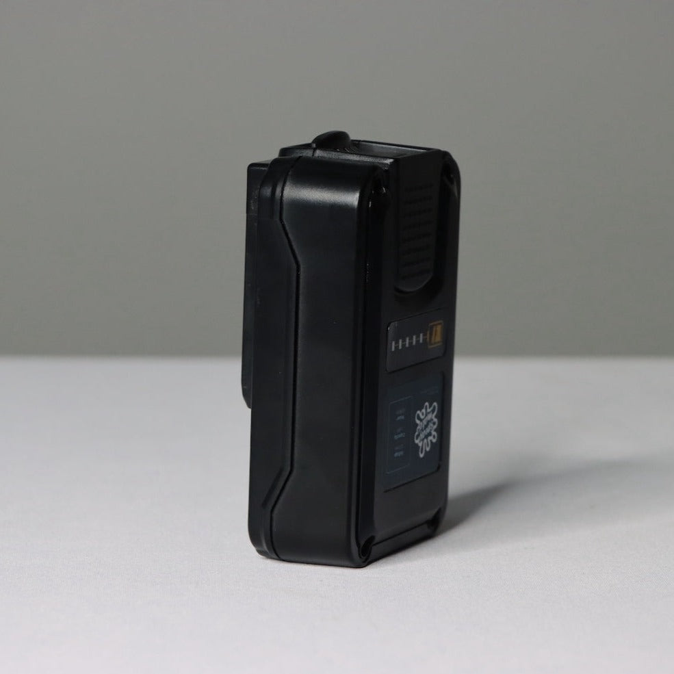 side profile of battery pack on a white table